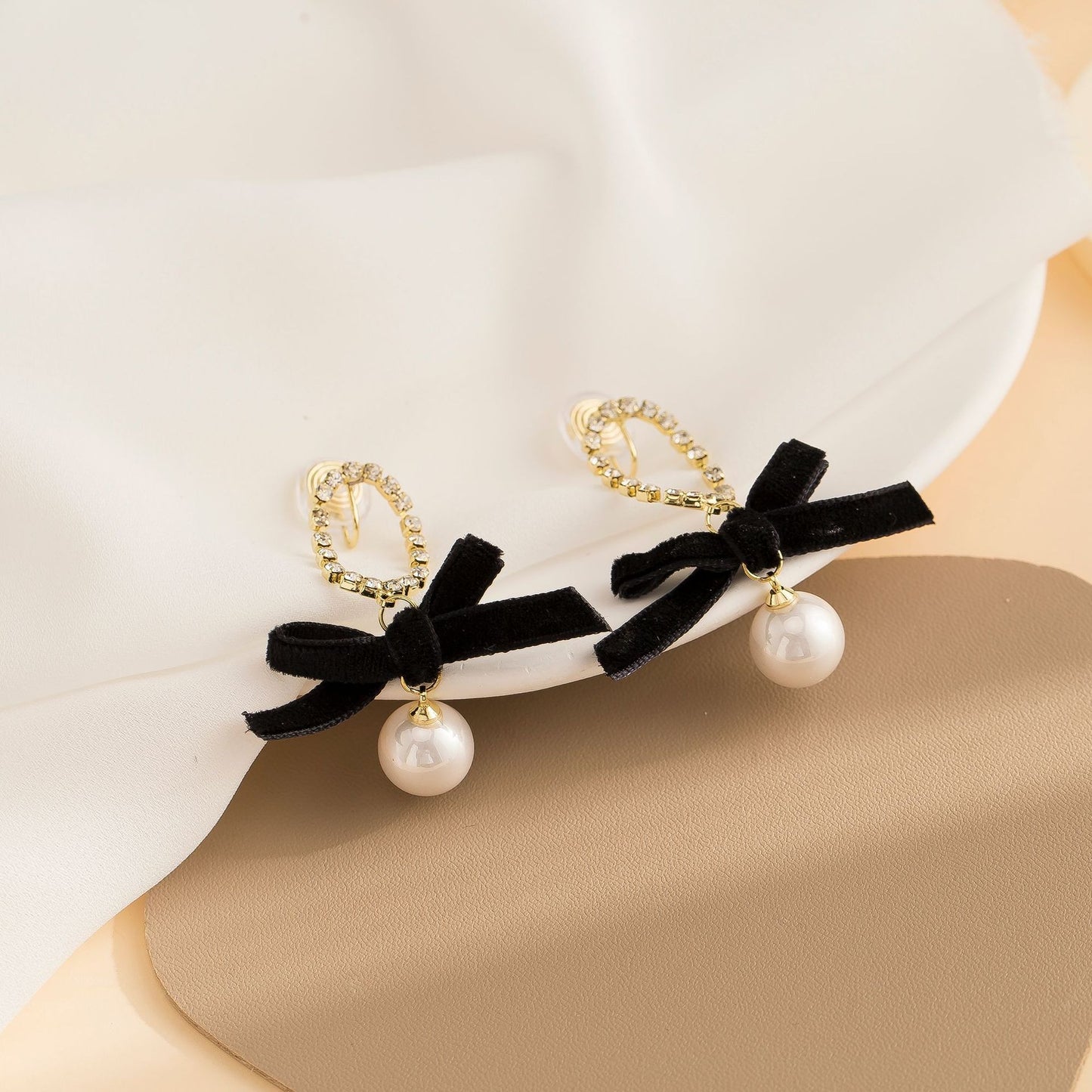 Black bow pearl long earrings, fashionable and elegant, light luxury mosquito coil ear clip